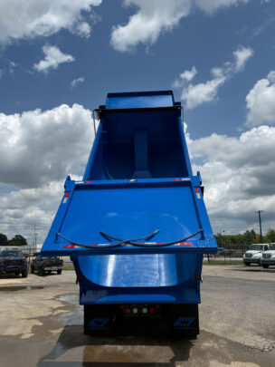 High-lift tailgate feature of the 21-Yard Elliptical Dump Body in action.